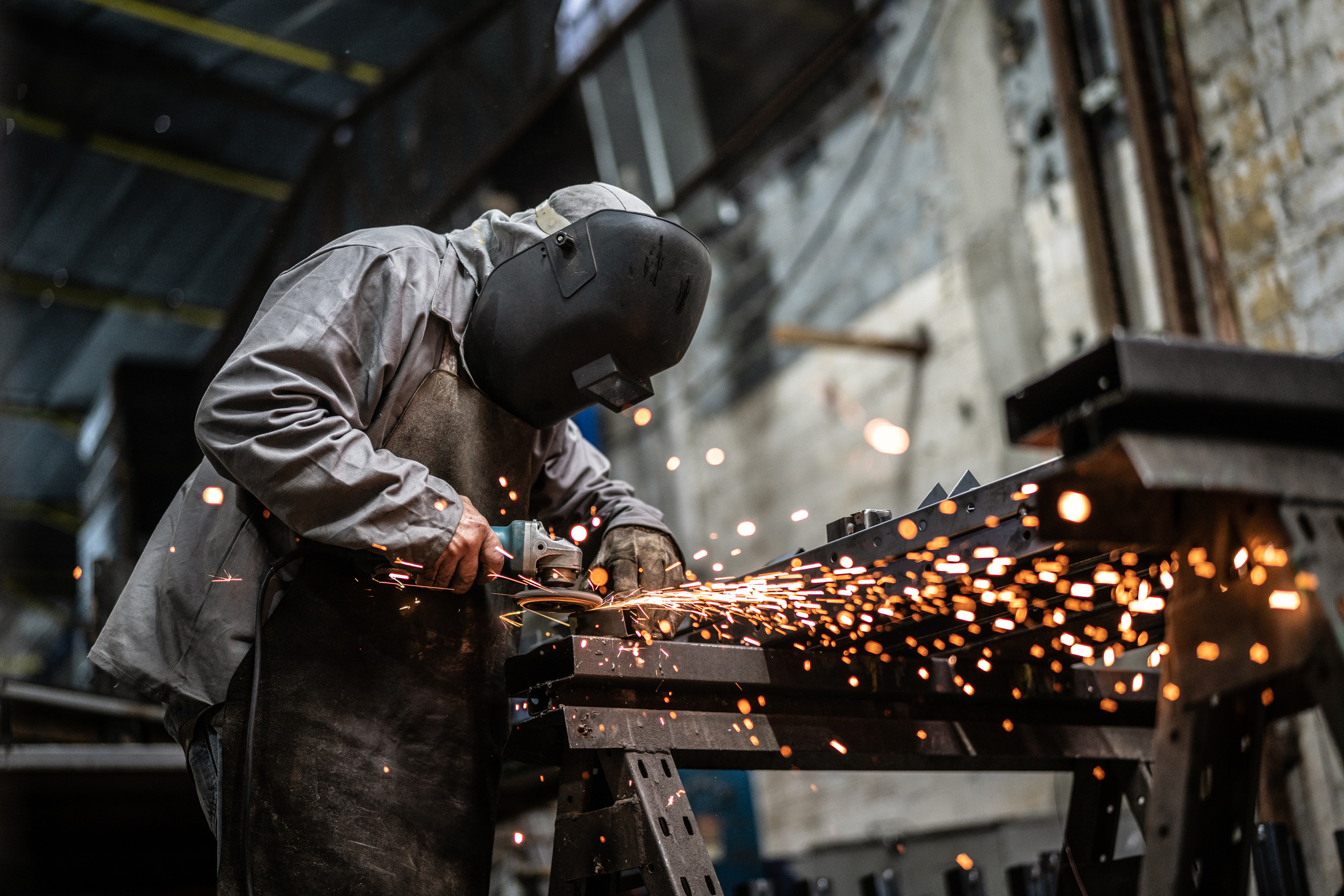 Industrial Worker welding steel